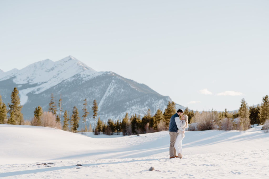 Couple embrases one another with the Ten Mile range in background. Breckenridge colorado couples session.