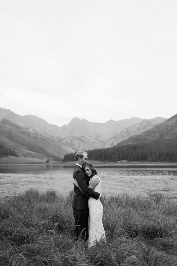 couple embracing in a meadow