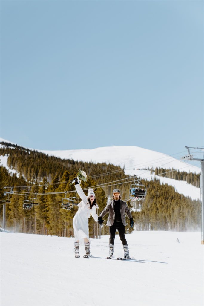 couple celebrating on the mountain at ski resort