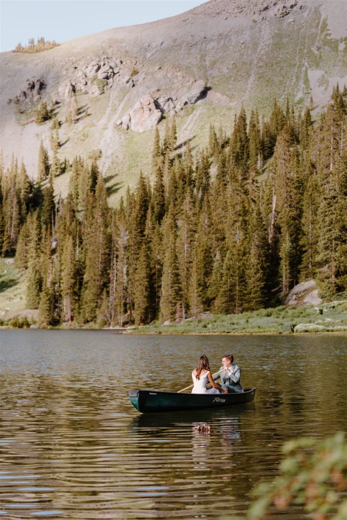 couple sitting in canoe on a lake