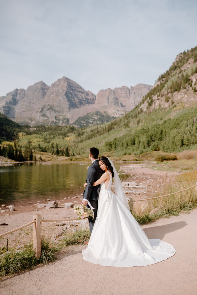 couple together on wedding day at maroon bells