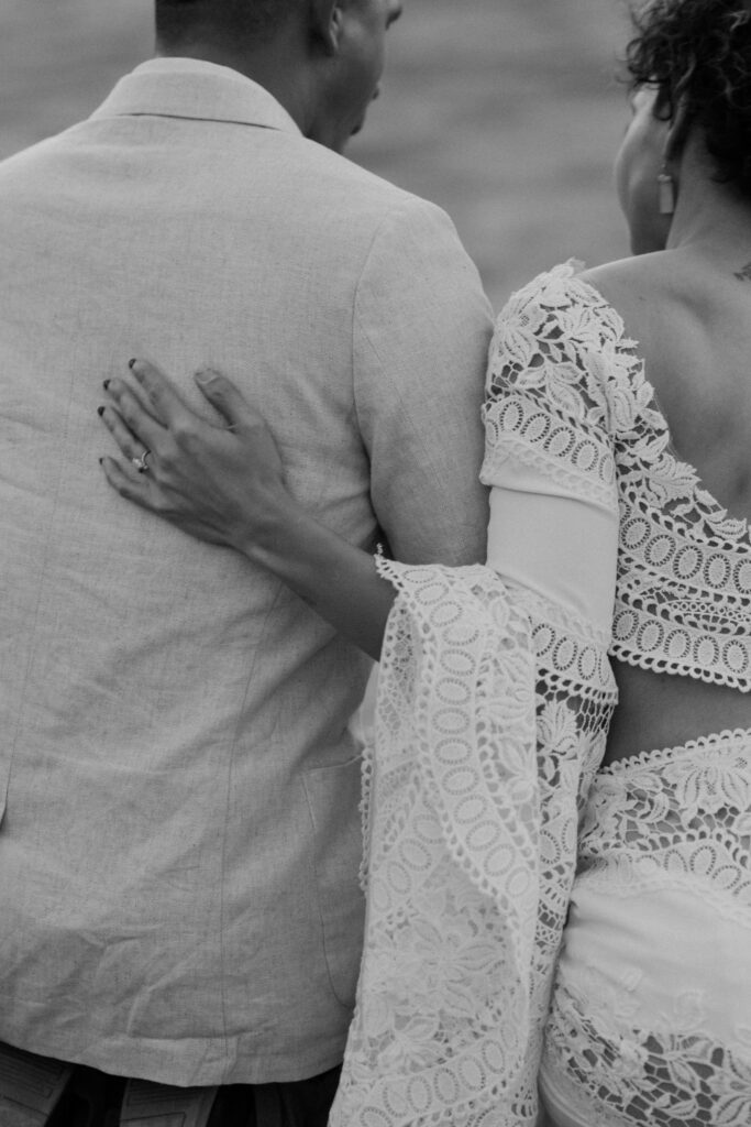 black and white photo of couples backs