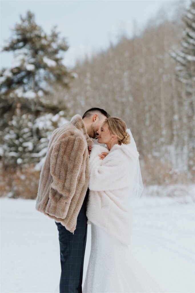 couple hugging with fur coats on