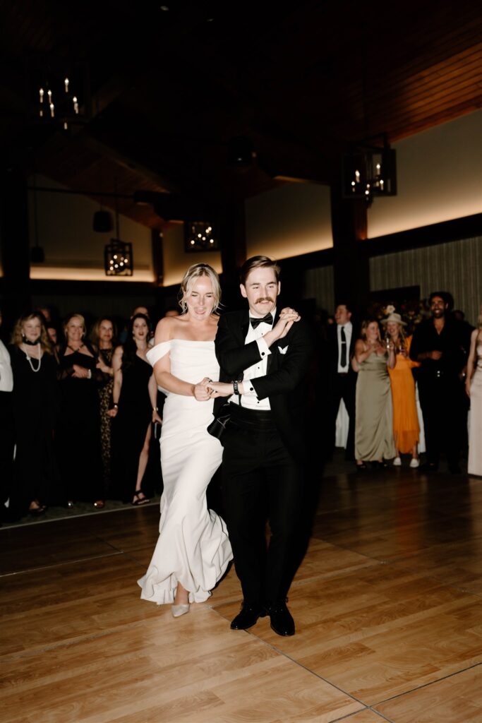 bride and groom dancing at their mountain wedding reception