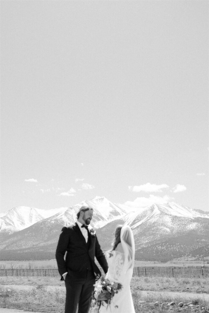 bride and groom with the colorado mountains in the backdrop