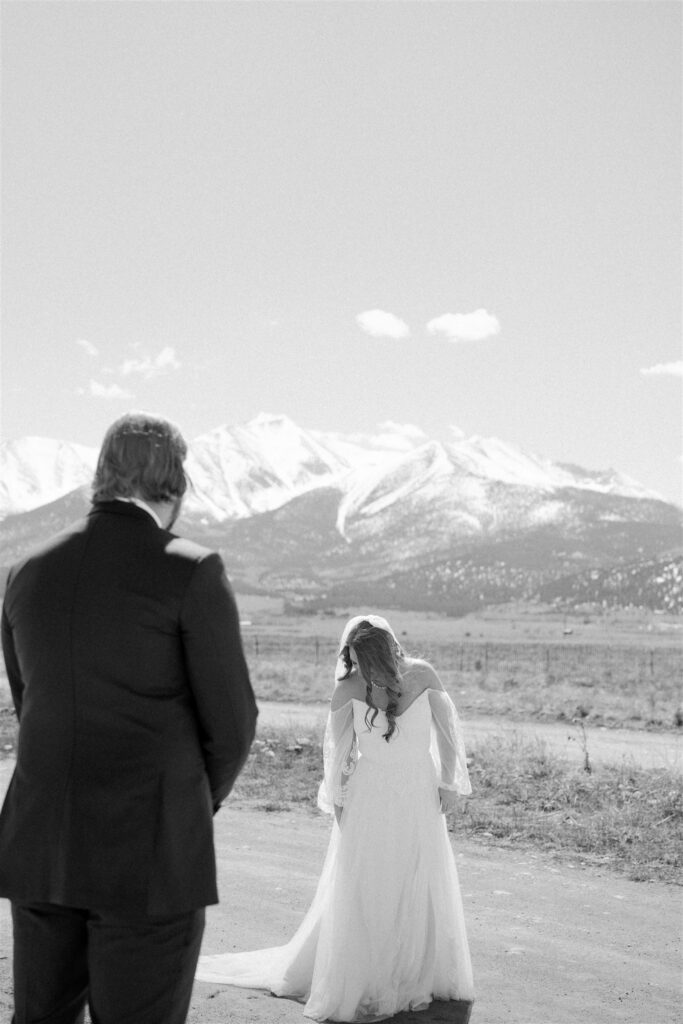 bride and groom with the colorado mountains in the backdrop