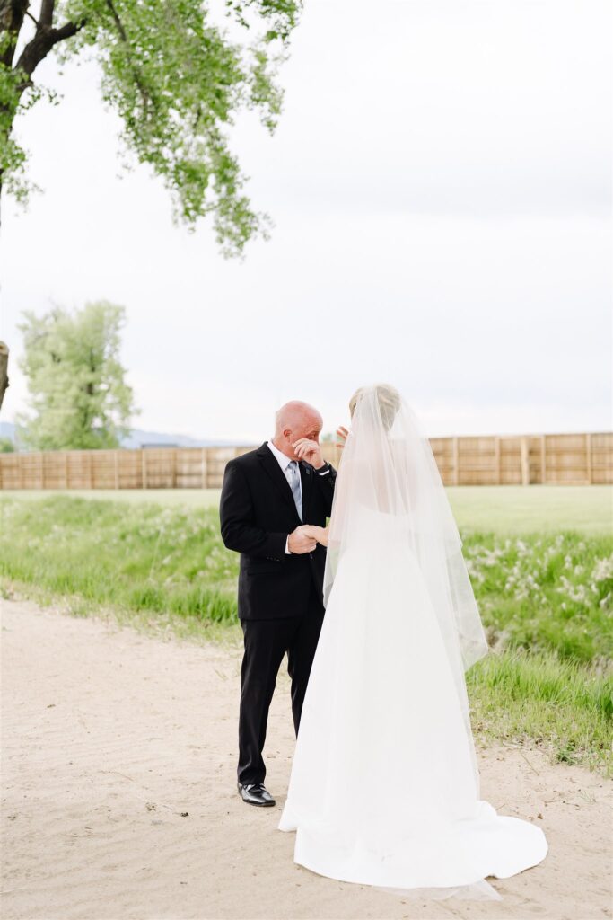 Bride and father share tears during first look