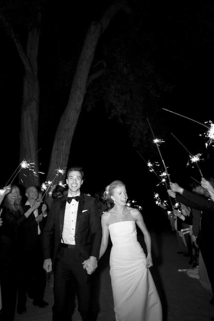 Bride and groom walk through their sparkler exit