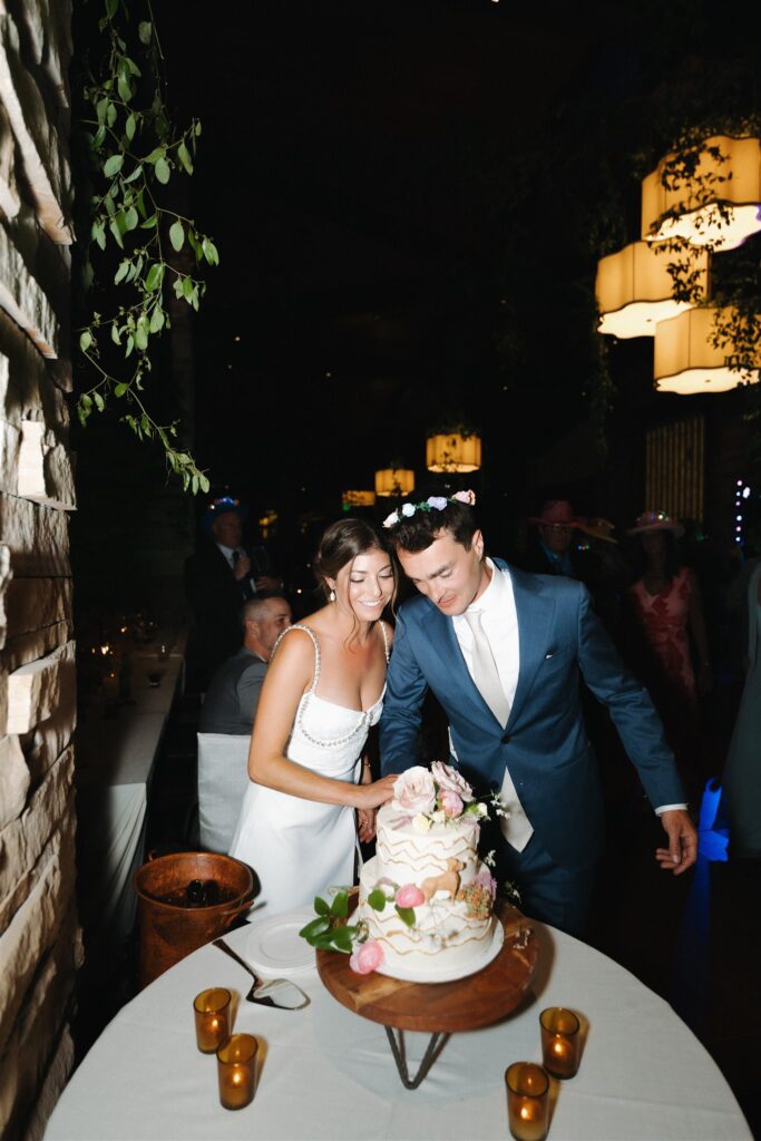 Bride and groom cutting their wedding cake