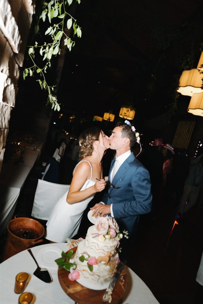 Bride and groom cutting their wedding cake