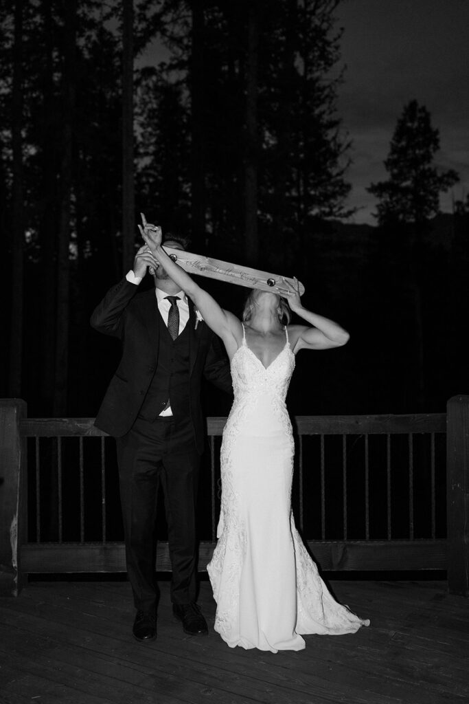 Bride and groom take a shotski to celebrate their wedding in Telluride