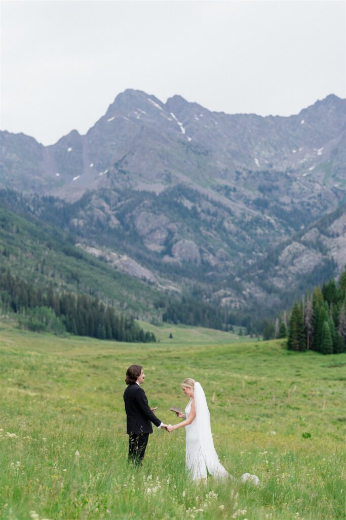 Bride and groom read their vows for their Colorado micro wedding