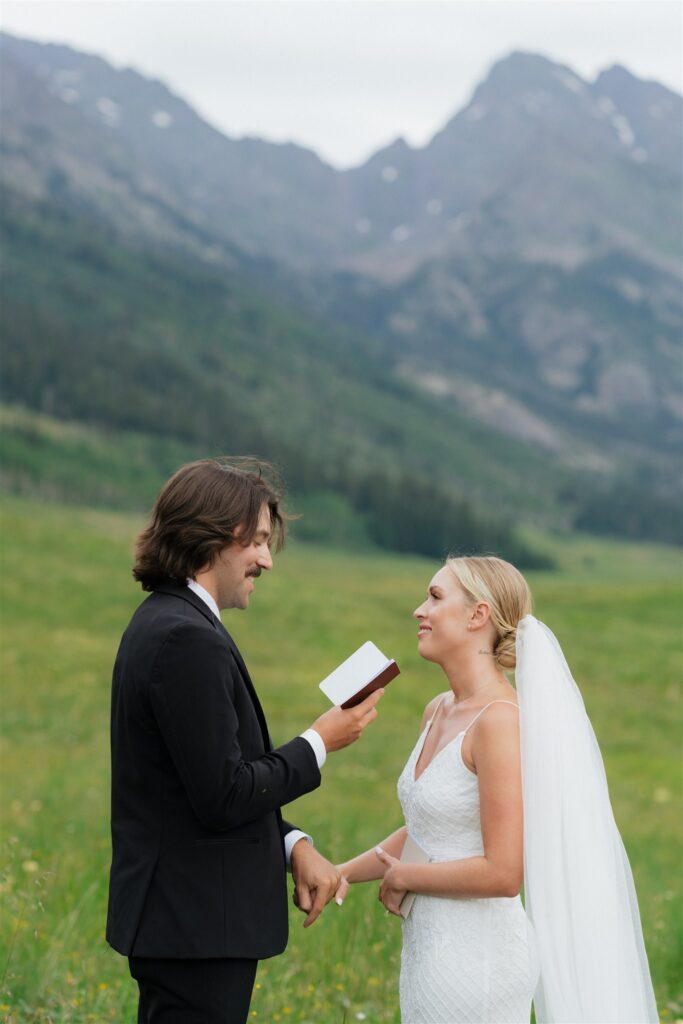 Bride and groom read their vows for their Colorado micro wedding