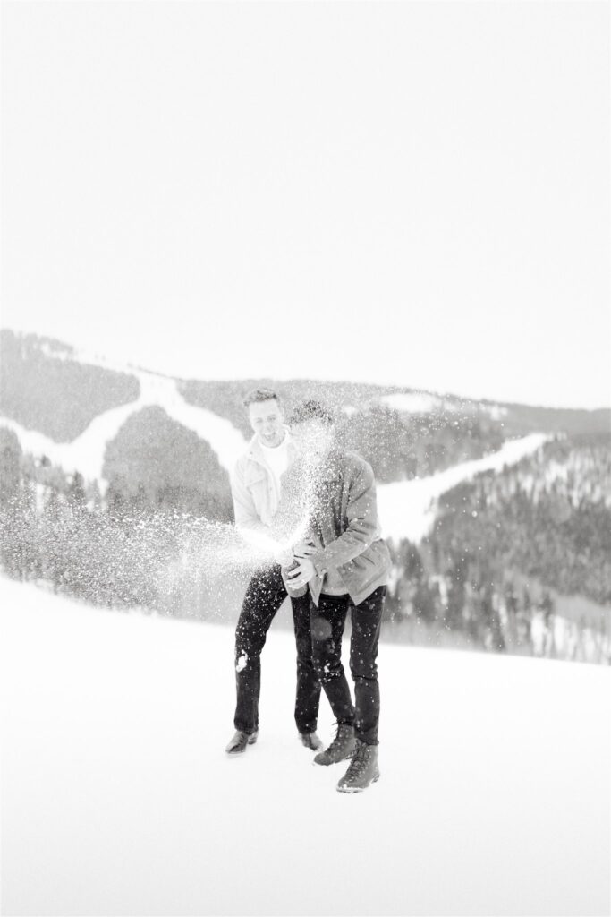 Couple celebrates after their successful winter proposal in Vail