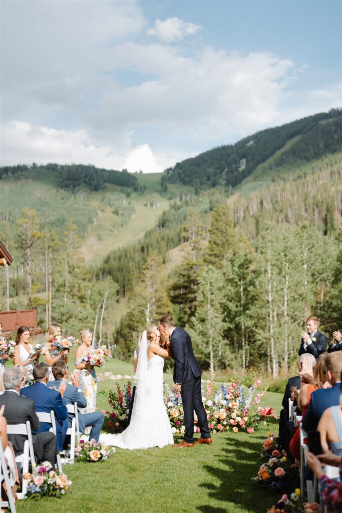 A Beano's Cabin wedding ceremony with a mountain backdrop