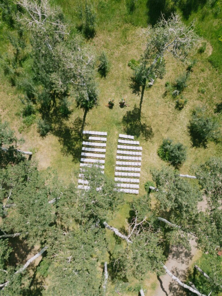 Drone shots of the ceremony setup within the aspens at Flying Diamond Ranch