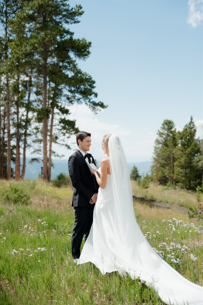 Bride and groom read private vows on Vail Mountain