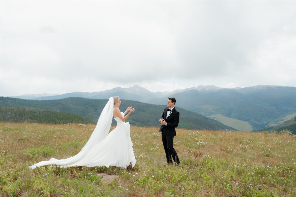 Bride and groom first look on Vail Mountain before their golf club wedding ceremony