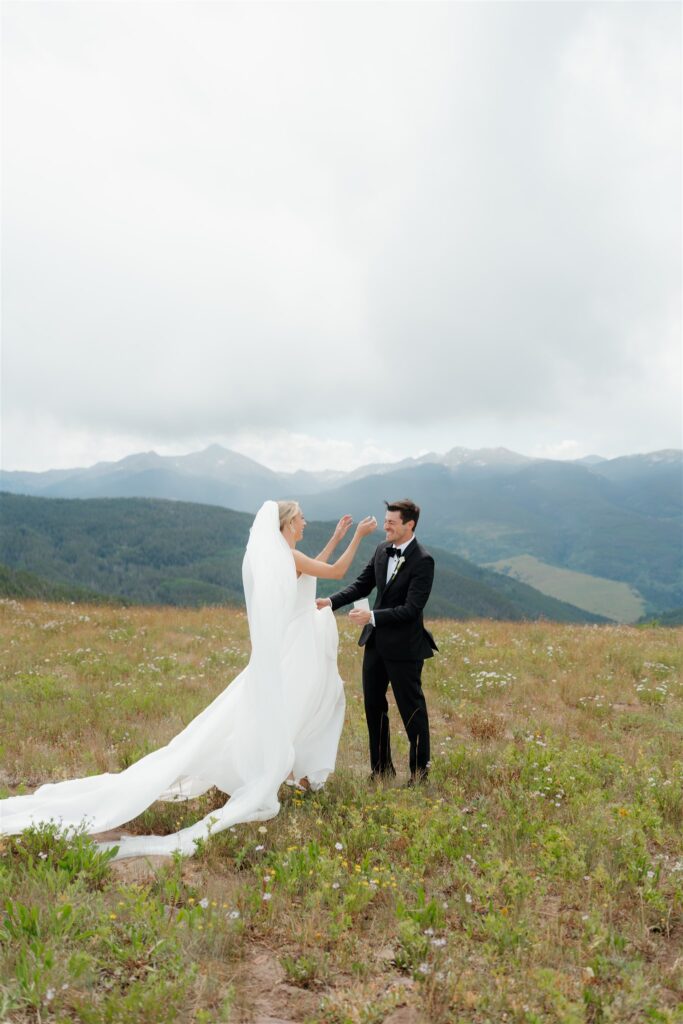 Bride and groom first look on Vail Mountain before their golf club wedding ceremony