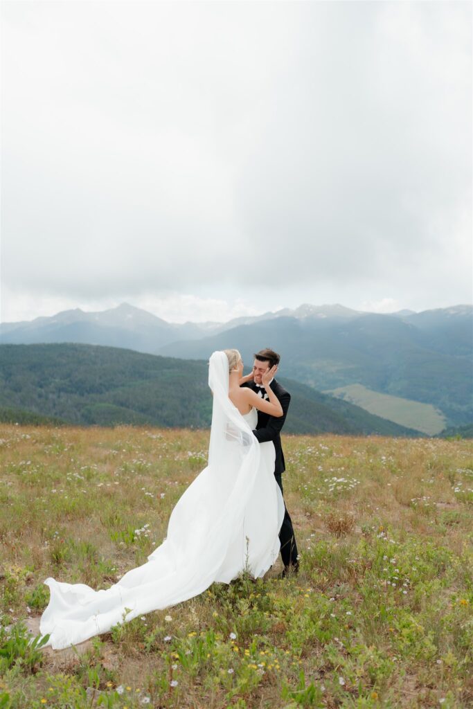 Bride and groom first look on Vail Mountain before their golf club wedding ceremony