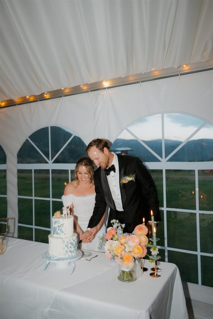 Camp Hale wedding reception cake cutting