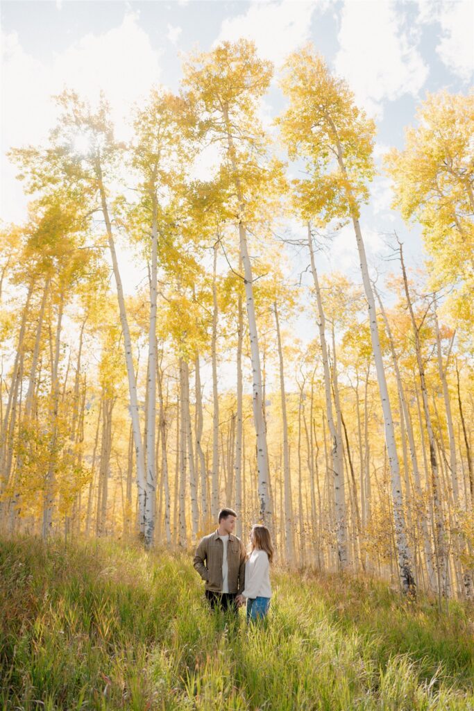 Colorado Fall Engagement Photos surrounded by golden aspen trees