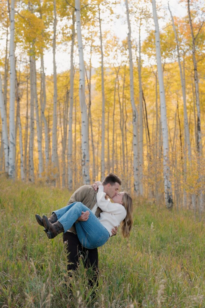 Colorado Fall Engagement Photos surrounded by golden aspen trees