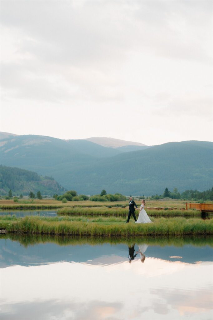 Alpine Lake bride and groom portraits in Colorado at sunset
