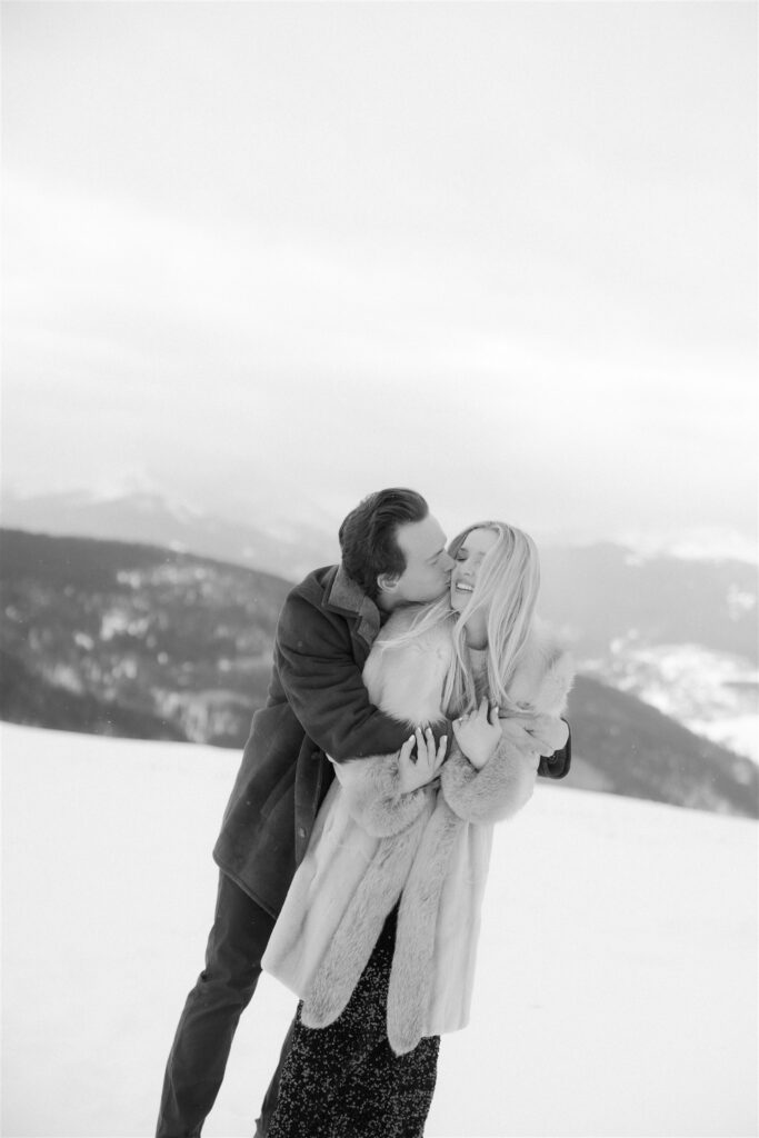 Playful winter engagement photos in the snow in Vail, Colorado