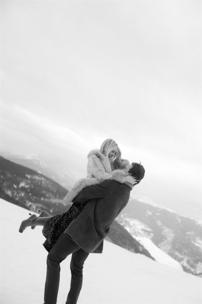 Playful winter engagement photos in the snow in Vail, Colorado