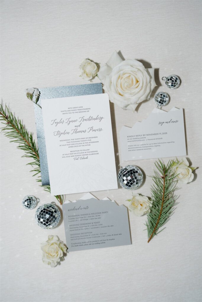 Colorado winter wedding flat lay photos with mini disco balls and pine tree branches