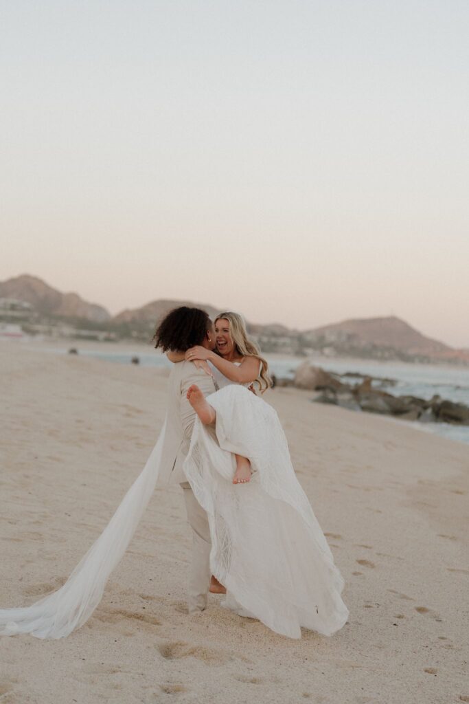 Bride and groom photos on the beach at sunset in Cabo San Lucas