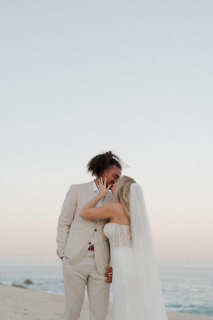 Bride and groom photos on the beach at sunset in Cabo San Lucas