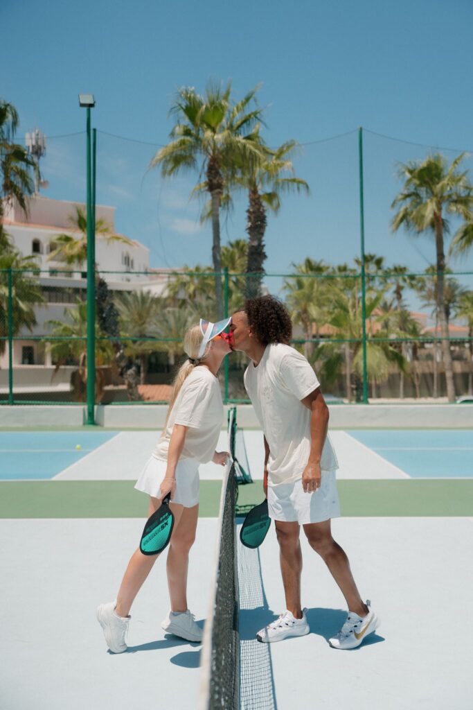Bride and groom play in a pickleball tournament with their guests at Hilton Los Cabos