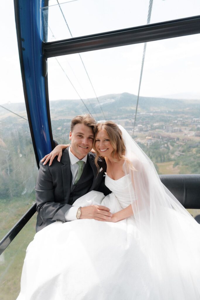 Bride and groom ride the gondola up to the mountaintop at Steamboat Resort
